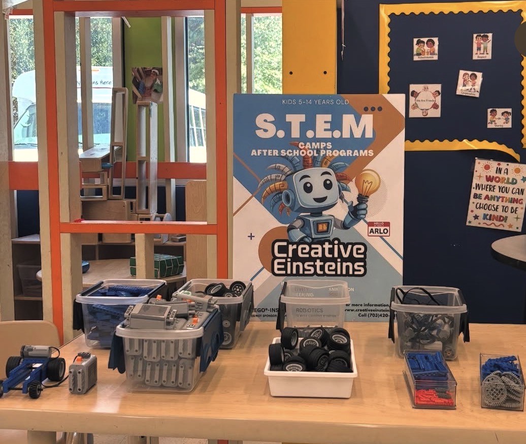 Children building robots indoors for an afterschool program