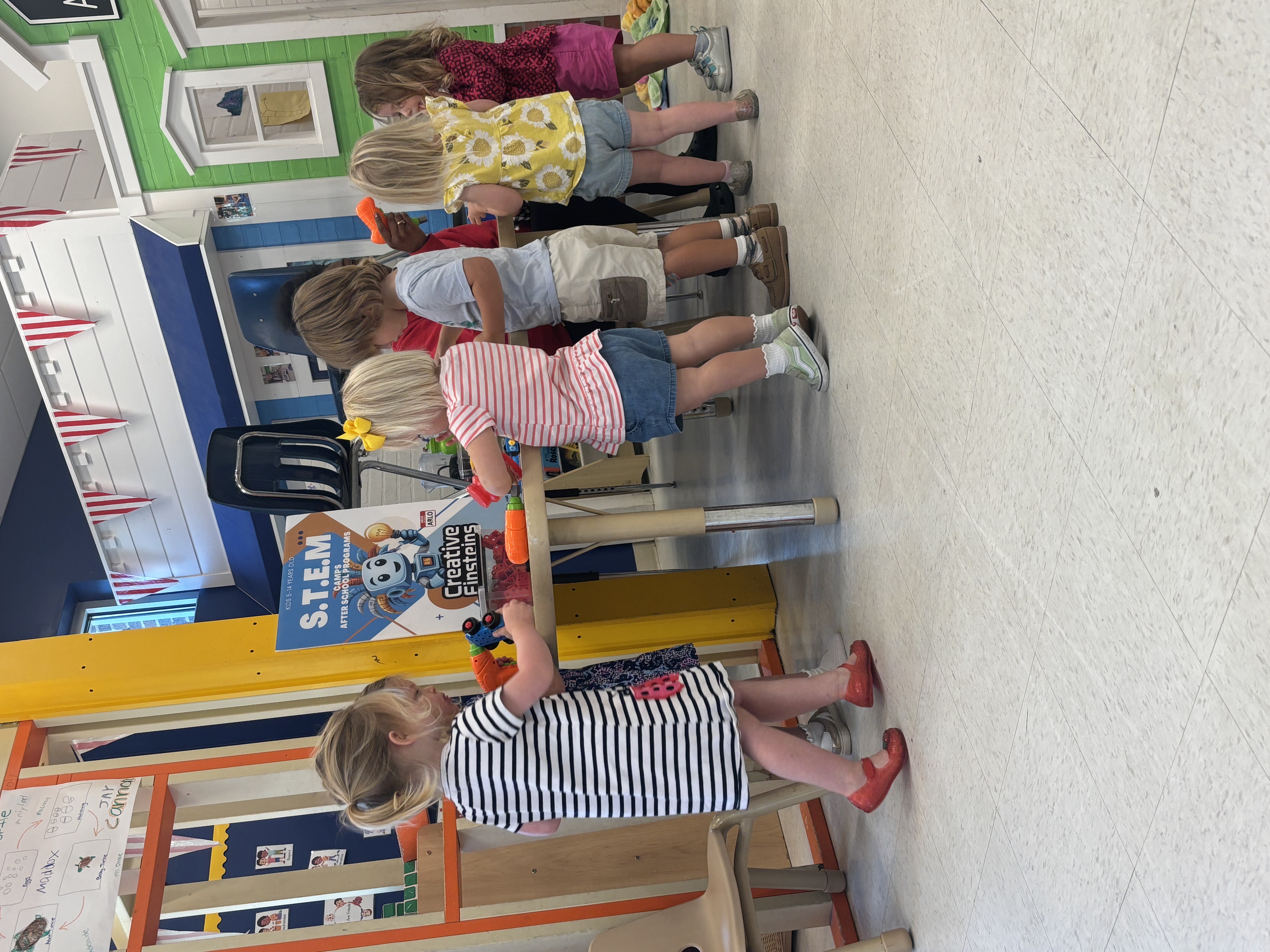 Child building with a mechanical kit